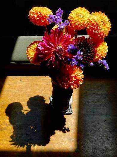 Fresh flower arrangement on workspace
